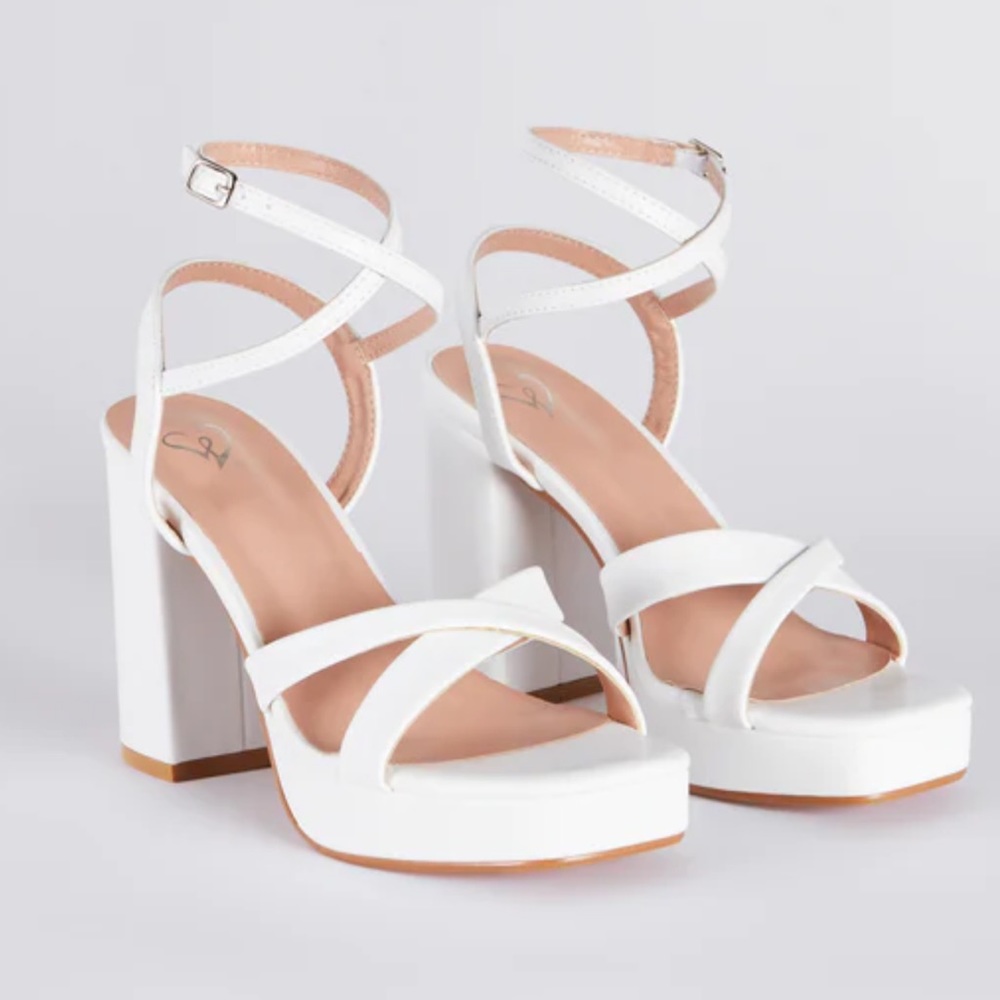 New without tags. never worn, white, criss cross platform block heels , size 7